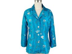 "This blouse or blouse/jacket is made of a beautiful silk embroidered fabric. The style is a princess cut, with 3 shell buttons, notched collar, slit in the sides. Back length is approximately 24 1/2\" The sleeves are 3/4 length with a slit that can be turned up as a cuff. A successful style as it is very versatile. Dress it up for a special occasion or wear it open as jacket for a relaxed look This listing is for Teal embroidery, but also available in Black. The Black is also listed separately Blouse Boat Neck, Ikat Scarf, Ikat Blouse, Silk Chiffon Scarves, Vintage Shawls, Chiffon Wrap, Blouse Silk, Silk Ikat, Fitted Blouses