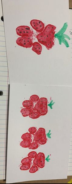 two drawings of strawberries on paper next to each other