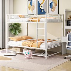 a white bunk bed sitting on top of a hard wood floor next to a desk