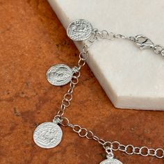 Sterling silver replica Roman coin charm chain bracelet. Great stacking bracelet or worn on its own! Length: 7.5" Diameter: 60mm 4mm chain Coins measures: 11.8mm Weight: 5.79 grams 925 sterling silver Lobster clasp Silver Tarnish-resistant Metal Charm Bracelet, Tarnish Resistant Silver Chain Bracelet In Sterling Silver, Adjustable Silver Coin Pendant Jewelry, Tarnish Resistant Sterling Silver Round Bracelet, Tarnish-resistant Sterling Silver Round Bracelet, Metal Coin-shaped Jewelry With Charms, Tarnish-resistant Round Sterling Silver Bracelet, Silver Sterling Silver Coin Necklace With Adjustable Chain, Silver Bracelets With Coin Pendant As Gift