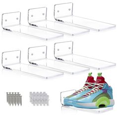 three clear acrylic shoe shelves with shoes on top and six pairs of screws next to them