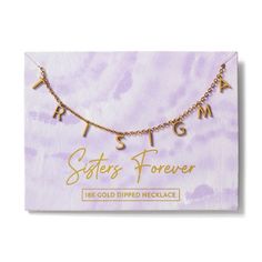 the sister's forever necklace is shown on top of a purple marble background with gold lettering