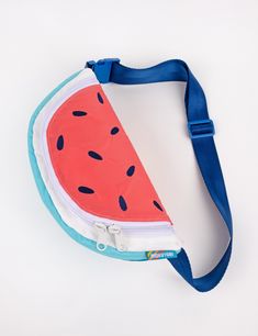 Be the epitome of summer and walk around with a bag that's the shape of a juicy slice of watermelon! This rad fanny pack also doubles as a cross-body bag! Features a double pull main zipper compartment and lining pocket. Constructed with with water resistant 100% nylon pack cloth. Color block rind detail & embroidered watermelon seeds. Explore all Fruit Slice Slings Adjustable 1.5" nylon seat belt webbing strap. Total bag + strap circumference minimum- 35"Total Bag + strap circumference maximum- Playful Summer Shoulder Bag For School, Playful Summer School Shoulder Bag, Playful Summer Bags With Adjustable Strap, Summer School Shoulder Bag With Zipper, Summer School Shoulder Bag With Zipper Closure, Summer Belt Bag With Adjustable Strap For Everyday Use, Adjustable Strap Belt Bag For Summer Everyday Use, Casual Summer Crossbody Belt Bag, Casual Summer Belt Bag With Zipper Closure