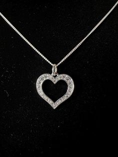 Silver, cubic zirconia, heart pendant on 16 inch, .925 sterling silver chain Cubic Zirconia Heart Pendant Jewelry, Cubic Zirconia Heart Pendant Jewelry With Charm, Heart-shaped Cubic Zirconia Jewelry With Diamond Accents, Heart-shaped Brilliant Cut Cubic Zirconia Jewelry, Sterling Silver Heart Pendant Diamond Necklace, Silver Heart Pendant Diamond Necklace For Formal Occasions, White Gold Crystal Heart Pendant Jewelry, Silver Crystal Heart Necklace For Anniversary, Formal Cubic Zirconia Jewelry With Heart Charm