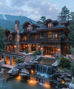 a large house with a waterfall in front of it