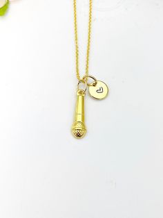 "This is a gold -tone Microphone charm with hand stamped initial charm on brass/stainless steel 18 inches chain. ♥ You will receive 1 necklace. HOW TO ORDER 1) Select the quantity 2) Select the initial  3) Add to cart DESCRIPTION ♥ Necklace, Gold Plated over Stainless steel or Brass Cable Chain with Lobster Claw Clasp, Size: about 17.7 inches (45cm) long, 1-2mm wide, Nickel Safe, ♥ Initial Charms, Gold Plated over Stainless steel, Size: about 8-10mm in diameter, 1mm thick, Nickel Safe, ♥ Microphone Charm, 304 Stainless Steel Pendants, Textured, Microphone, Golden, Size: about 0.24 inch(6mm) wide, 0.79 inch(20mm) long, 0.10 inch(2.5mm) thick PLEASE READ: *Materials and style may be different from the list depend on stock and style of the jewelry* Due to the shipping supply and the fee being Adjustable Gold Hand Stamped Charm Necklaces, Adjustable Hand Stamped Gold Charm Necklaces, Personalized Gold Charm Necklaces In Brass, Personalized Gold Brass Charm Necklaces, Gold Stamped Charm Necklaces As Gift, Personalized Stamped Gold Charm Necklace, Gold Stamped Initial Pendant Charm Necklace, Gold Microphone, Jewelry Card