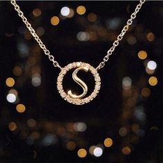 "The pendant measures 3/8\" (0.375\"). The weight of the 14k gold is 2.1 grams. There are 14 hand-selected, brilliant cut, G color, round diamonds in the halo with a total weight of 0.07 carats. This completely customizable necklace comes with your choice of initial, in your choice of 14k yellow, rose, or white gold, and on the chain length of your choice! We can even make the chain adjustable between two lengths (for example 16\" --> 18\"), if you would like this option please choose \"adjus Rose Gold Initial Pendant Necklace, Elegant Rose Gold Diamond Initial Necklace, Round Diamond Initial Necklace, White Gold Diamond Initial Necklace, Gold Diamond Necklace With Initials, Gold Initial Necklace With Diamond Accents, Rose Gold Diamond Initial Necklace As Gift, Rose Gold Diamond Initial Necklace For Gift, Rose Gold Diamond Initial Necklace For Anniversary