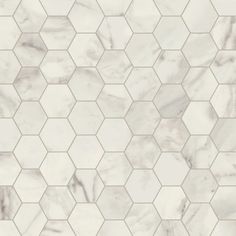 a white marble tile pattern with hexagon tiles in the middle and one on the other side