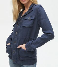 Classic fit linen jacket with a zip up and button closure. Hip-length jacket with four front pockets and drawstring to cinch in waist. Details 100% Linen Machine Washable Slightly Relaxed Fit/ TTS Linen Jacket, Anorak Jacket, Michael Stars, Military Inspired, Light Sweater, Utility Jacket, Natural Fabrics, Outerwear Women, Linen Fabric