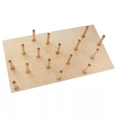 a wooden peg board with several holes in it