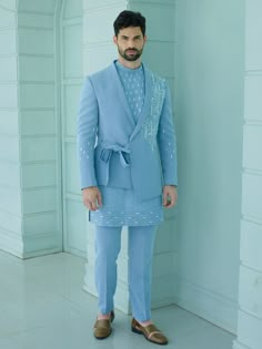 Blue Colour Handcrafted Designer Indowestern for groom or family & friends with elegant kurta inside made from the finest fabric will make you feel like a king on the happiest & most important day of your life.you can customize it according to your measurement as the fitting make it more beautiful to wear.Its beautifully hand embroidered and zari work on blazer & kurta,indowestern for men,indo western dress for men COST INCLUDED SHERWANI ,TROUSER & KURTA AS IN THE PICTURE New Dress Designs For Men, Indowestern Groom Outfit, Men’s Indo Western Outfit, Kurta With Blazer For Men, Fitted Blue Sherwani For Groom, Blue Fitted Sherwani For Groom, Fitted Blue Kurta For Groom, Formal Fitted Suit With Traditional Drape, Blue Semi-formal Suits For Eid