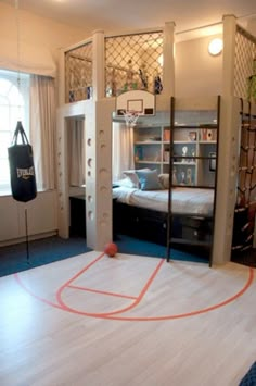 a basketball hoop is in the middle of a room with bunk beds and other items