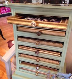 an antique dresser with many drawers and knobs