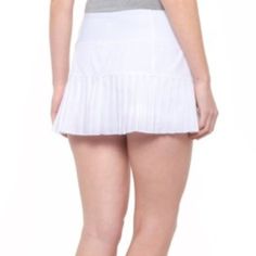 Anything Regular Shorts Can Do, Mondetta's Pleated Tennis Skort Can Do Better -- With Help From Quick-Drying, Stretchy Fabric And Built-In Shorts For Modesty And Coverage. Lightweight, Stretchy Fabric Blend Is Breathable And Quick Drying Integrated Stretch-Knit Shorts Flat Elastic Waistband Hidden Slip Pocket In Waistband Pleated Hem Made In Viet Nam Stretch White Pleated Bottoms, White Stretch Pleated Bottoms, White Pleated Stretch Bottoms, Fitted Pleated Bottoms, Short Length, Fitted Pleated Short Bottoms, Fitted White Pleated Bottoms, Pleated Fitted Bottoms With Short Leg, Black Tennis Skirt, White Tennis Skirt