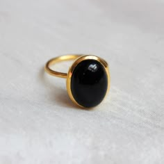 D E T A I L S - Material: 925 Sterling Silver Stone: Black Onyx Stone Shape: Square The fit: True to US ring size Finish: Smooth and gold plated to a high shine S H I P P I N G & P R O D U C T I O N - My current production time is 2-6 business days, which means after those days are up, your order ships! I make everything custom to order, by hand, but I promise you it's worth the wait! R U S H - M Y - O R D E R - If you're in a rush to get your pretty new pieces, please send me a message and Oval Onyx Cabochon Ring, Oval Cabochon Onyx Ring, Oval Onyx Ring With Cabochon, Onyx Oval Cabochon Rings For Gift, Oval Cabochon Onyx Ring Gift, Oval Stone Ring, Onyx Engagement Ring, Black Stone Ring, Gold Rings Fashion