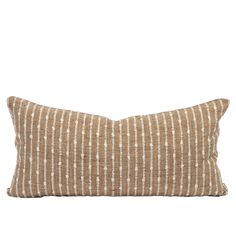 a brown and white striped pillow on a white background