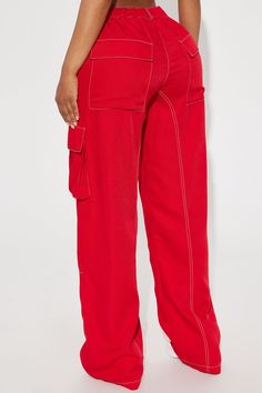 Available In Black And Red. Wide Leg Pant High Rise Elastic Waist Tie Waist Contrast Stitching Wide Leg Non Stretch 33" Inseam 100% Polyester Imported | Keep Me Entertained Wide Leg Cargo Pant in Red size Small by Fashion Nova Red Cotton Bottoms With Belt Loops, Red Cotton Pants With Cargo Pockets, Red Cotton Cargo Pants, Red High Waist Parachute Pants With Pockets, Red Cotton Parachute Pants With Cargo Pockets, Red Wide Leg Bottoms With Cargo Pockets, Red Bottoms With Side Pockets And Relaxed Fit, High Waist Red Cotton Cargo Pants, High Waist Red Cargo Pants With Pockets