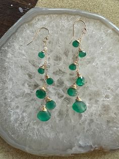 14kt gold filled ear hooks and chains with graduated green onyx briolettes, 2" (see Cleo style for similar options in other colors )This green is one of a kind for fall 2022 & see pics for other green onyx styles to compliment Other green styles shown in this image set are the Jetty punch in green onyx, the Love dangles, the margaret and Mini Gemma all in green onyx Green 14k Gold-filled Dangle Earrings, Green 14k Gold Filled Dangle Earrings, Elegant Green Onyx Dangle Earrings, Elegant Green Onyx Dangle Jewelry, Green Onyx Dangle Jewelry, Green Wire Wrapped Long Drop Earrings, Nickel Free 14k Gold Filled Green Jewelry, Nickel-free 14k Gold-filled Green Jewelry, Nickel-free Green Jewelry In 14k Gold-filled