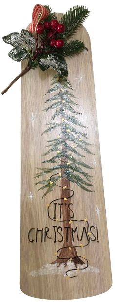 a wooden sign with a christmas tree on it