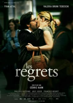 the poster for les regrets is shown with a man kissing a woman's face