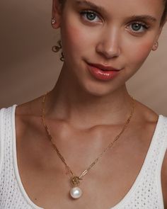 Mother Nature, upping your style game since forever. A classic chain never goes out of style, but add a perfect pearl and a toggle detail and you’ve got a necklace you’ll never want to take off. DETAILS: Pendant Necklace Length: 22" Front Toggle Closure SKU: N6226 MATERIALS: 18k Gold Plated Over Brass Shell Pearl Fine Jewelry Pearl Pendant For Everyday Luxury, Elegant Toggle Necklace With Round Pendant, Elegant Gold Plated Toggle Necklace For Formal Occasions, Elegant Link Chain Necklace With Toggle Clasp, Elegant Gold-plated Toggle Necklace For Formal Occasions, Everyday Luxury Yellow Gold Jewelry With Pearl Pendant, Elegant Formal Gold Plated Toggle Necklace, Elegant Gold Plated Toggle Necklace With Round Pendant, Classic Pendant Jewelry With Lobster Clasp