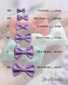 four small bow clips in different colors are shown on a white background with measurements for each one