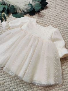 ♡ MADE OF: Ecru fabric with layersnof beige tulle. The lining is made of 100% cotton ♡ Processing time is usually 5-7 days.  ♡ CARE INSTRUCTIONS: Wash in cold or warm water (30oC/ 65 - 85F). Do not use bleach. Dry at low temperatures, do not use machine drying. Iron at medium or low temperature. Hand wash and hang dry for longer wear. Organza Princess Dress With Tulle Skirt For Baptism, Off White Organza Wedding Dress, Princess Style Organza Tutu Dress For Baptism, Organza Tutu Dress With Tulle Skirt For First Communion, Elegant Beige Princess Dress For Party, Cream Organza Dress For Baptism, Elegant Cream Dress With Tulle Skirt, Long Sleeve Tutu Dress With Ruffles For Wedding, White Tulle Baptism Dress For Spring