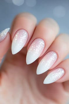 These ombré nails with subtle glitter make a gorgeous choice for winter nails! The soft gradient is perfect for any winter occasion, from casual to glam. Find more stunning winter nails ideas at nailhow.com. Save this pin and let your nails shine this winter! Winter Nails Ombre Glitter, Glitter Ombre Christmas Nails, Snow Inspired Nails, Cute Ombre Nail Designs, Holiday Ombre Nails, Winter Nails With Glitter, Ombre Winter Nails, Christmas Ombre Nails, Subtle Winter Nails