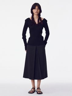 The Inverted Pleat Skirt is a beautifully tailored piece that showcases classic design with a modern twist. It features a high-waisted fit that accentuates the waistline, while the inverted pleats create a graceful, flowing movement. - This skirt is designed with a structured waistband to provide support and a seamless silhouette.- The inverted pleat detail not only adds an element of sophistication but also allows for a greater range of motion.- It's a versatile item that can be dressed up for formal occasions or paired down for a day at the office.- Meticulously stitched, the skirt holds its shape throughout the day, making it both stylish and practical for continuous wear. Modern Full Skirt Fitted, Modern Fitted Full Skirt, Elegant Asymmetrical Skirt With Accordion Pleats, Evening Flared Skirt With Box Pleat, Elegant Asymmetrical Pleated Relaxed Skirt, Asymmetrical Pleated Waist Skirt, Elegant Pleated Hem Asymmetrical Skirt, Modern Fitted Pleated Skirt, Elegant Asymmetrical Pleated Skirt For Formal Occasions