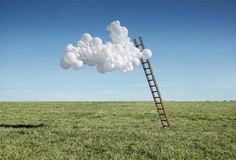 a ladder reaching up into the sky with clouds floating over it