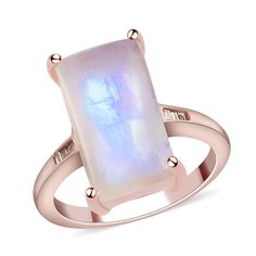 Designed on the deco theme, this moon glow moonstone ring features clean lines, symmetry, and geometry. Made from sterling silver, this deco ring features a baguette-shaped moon glow moonstone set in the prong setting. The band of this moon glow moonstone ring has been adorned with champagne diamond baguettes set in the channel. The metal frame of this ring has been drenched in rose gold vermeil for a rich sumptuous look. The ring is a classic piece of jewelry that you can flaunt with all your wardrobe staples. Moon glow moonstone displays a beautiful shift in blue hues. The moonstone gems possess adularescent qualities. Adularescence refers to the ripping of blue light when exposed to the interplay of lights. This property of the moonstone is affected by the position of feldspar in the ge Champagne Diamond Ring, Champagne Diamond Rings, Moon Glow, Deco Ring, Champagne Diamond, Moonstone Ring, Baguette Diamond, Blue Hues, Gold Vermeil