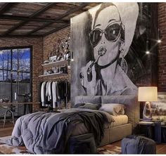 a bedroom with a large painting on the wall