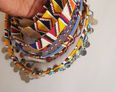 These are 100% handcrafted using fine beads, beading wire and chains. This listing is for ALL 5 necklaces. Perfect for weddings, traditional events, African themed events.etc Buy multiple items and pay shipping for ONE item only. More neckleces here; https://www.etsy.com/shop/TribalTess?ref=seller-platform-mcnav&section_id=21306083 Back to my shop; https://www.etsy.com/shop/TribalTess?ref=seller-platform-mcnav Multicolor Beaded Necklaces For Traditional Ceremonies, Hand-strung Multicolor Necklaces For Festivals, Traditional Hand-strung Beaded Necklaces For Festivals, Traditional Multi-strand Beaded Necklaces For Festivals, Masai Necklace, Leather Beaded Necklace, African Necklace, Beaded Rope, Beading Wire