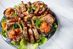 a platter filled with meat and vegetables