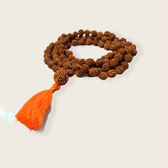 Rudraksha Mala necklace 10mm with 15mm guru bead. Hand Knotted with a cotton tassel. Hindu mala for meditation or chanting. Holistic Necklaces With 8mm Beads For Festivals, Holistic Necklaces With 8mm Beads For Rituals, Hand-strung Spiritual Necklace For Puja, Hand-strung Spiritual Necklaces For Puja, Spiritual Hand-strung Necklaces For Puja, Spiritual Mala With 8mm Beads For Rituals, Bohemian Hand Wrapped Mala For Meditation, Bohemian Adjustable Mala For Puja, Traditional Hand Knotted Mala For Meditation