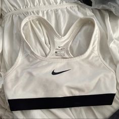 White Nike Sports Bra, Never Worn Perfect Condition. Size Medium But Fits Like A Small Or Xs White Activewear With Light Support For Sports, White Nike Tops For Gym, Nike Sporty Racerback Sports Bra, White Athleisure Sports Bra With Light Support, Nike White Tops For Gym, White Athleisure Sports Bra For Gym, Nike Sporty Athletic Fit Sports Bra, White Light Support Sports Bra For Athleisure, Nike Sporty Tops With Light Support