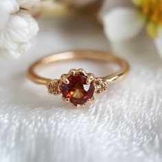 *All sizes are available. If you don't see your size, just add a note in your order when you check out.* Specification: Item Type: Ring Metal: Silver/14k gold Main Stone: Garnet 5-6mm Stone Color: Red/Orange *Our gemstones are hand selected, and set on a beautiful shank for a one-of-a-kind work of art. Every piece is handmade and varies slightly, just made for the same unique you! **Please note each gemstone is one of a kind. Each gemstone will display it's own unique personality, and each gemst Gold Engagement Ring Gemstone, Engagement Rings Gold Colored Stone, Antique Ruby Ring Gold, Red Engagement Ring Unique, Engagement Rings Red Stone, Wedding Ring Gemstone, Red Engagement Rings, Ruby Ring Simple, Vintage Garnet Rings