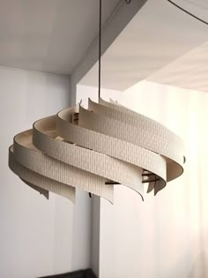 a light fixture hanging from the ceiling in a room