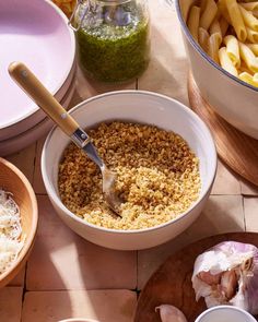 some food is being prepared in bowls on the table