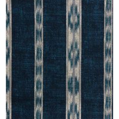 a blue and white striped rug with an abstract design on the bottom half of it