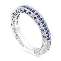 "HERE IS BEAUTIFUL UNIQUE HALF ETERNITY BLUE SAPPHIRE WEDDING & ANNIVERSARY BAND !! Vintage Style Engraved & Heart Love Design Wedding Band 14 Karat White Gold 42 AAA Sapphire 0.38 Carat !! Very Sweet Blue Color And Clean Sapphire !! Full Pave Set With Milgrain !! Ring Size Is 6 Free Sizing Available !! RETAIL PRICE IS OVER $1,350.00 COMES WITH $1,150.00 CERTIFIED APPRAISAL DREAM IT I\"LL MAKE IT SPECIAL ORDER WELCOME PLEASE VISIT MY ETSY SHOP http://www.etsy.com/shop/JewelryByGaro HANDCRAFTED I Sapphire Wedding Bands, Wedding Bands White Gold, Wedding Band Sapphire, Sapphire Anniversary Ring, Natural Blue Diamond, Sapphire Anniversary, Milgrain Ring, Sapphire Wedding Band, Wedding Band Designs