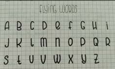 the upper and lower case of an old fashioned handwritten font on a sheet of paper