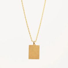 Golden Lola Pendant Necklace – Gwen Beloti Collection Minimalist Chain Necklace With Large Pendant, Minimalist Chain Necklace With Large Pendant As Gift, Modern Pendant Necklace With Delicate Chain, Modern Brass Necklace With Delicate Chain, Everyday Clavicle Chain Necklace With Rectangular Pendant, Clavicle Chain Necklace With Rectangular Pendant, Modern Yellow Gold Pendant Charm Necklace, Classic Necklace With Rectangular Pendant And Delicate Chain, Minimalist Jewelry With Rectangular Clavicle Chain Pendant