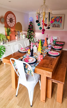 a dining room table with plates and place settings