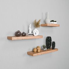 two wooden shelves with decorative items on them