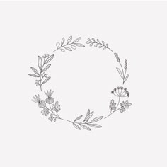 a black and white drawing of a circle with flowers in the shape of a wreath