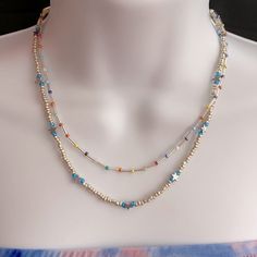 Gorgeous Brand New Multicolored Blue Toned Beaded Bohemian Layered Necklace With Silver Hardware And An Adjustable Chain. Super Dainty And Cute. Has Little Star Silver Beads And Other Ceramic Ones As Well Silver Necklaces For Summer Festivals, Summer Blue Necklaces With Spacer Beads, Blue Jewelry With Silver Beads For Summer, Handmade Silver Beaded Necklaces For Summer, Handmade Silver Beaded Necklace For Summer, Light Blue Beaded Necklaces With Round Beads For Summer, Blue Beaded Necklaces With Spacer Beads For Summer, Blue Beaded Necklace With Spacer Beads For Summer, Blue Bohemian Beaded Necklaces For Summer