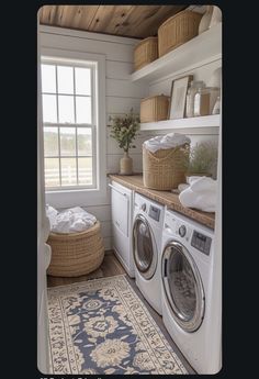 a washer and dryer in a small room with wood flooring on the walls