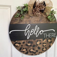 a leopard print door hanger that says hello there