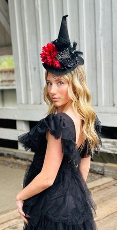 The perfect hat for Halloween!! Rich red and black colors and one of my favorite and most popular designs!  My daughter who's 15 loves to wear this one with the alligator clips attached under the brim so you can wear it centered or propped to the side.   Another popular way is our fabric lined u shaped flexible headband {one size fits most). This hat is sure to be a hit at parties!! Any questions please ask! Fun  black red witch  hat with rolled satin flower, bird cage netting and feathers. Has a band of ruffles around the base of the hat!     ♥ I do accept custom orders if I'm not too busy with orders, so if you see something in my shop but want it slightly different, just let me know! I have a lot of colors/styles, I just haven't posted them all. ♥o Black Wide Brim Top Hat For Costume Party, Whimsical Black Costume Accessories, Black Witchy Hat With Curved Brim, Gothic Black Mini Hats For Halloween, Fitted Wide Brim Top Hat For Halloween, Wide Brim Fitted Top Hat For Halloween, Black Mini Hat For Halloween Cosplay, Gothic Black Top Hat For Costume Party, Fitted Witchy Hat For Halloween